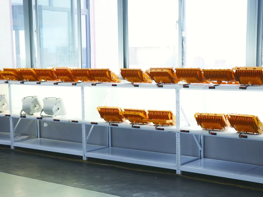 LED fixtures powered on burn-in racks for aging test at Sunjoylight factory